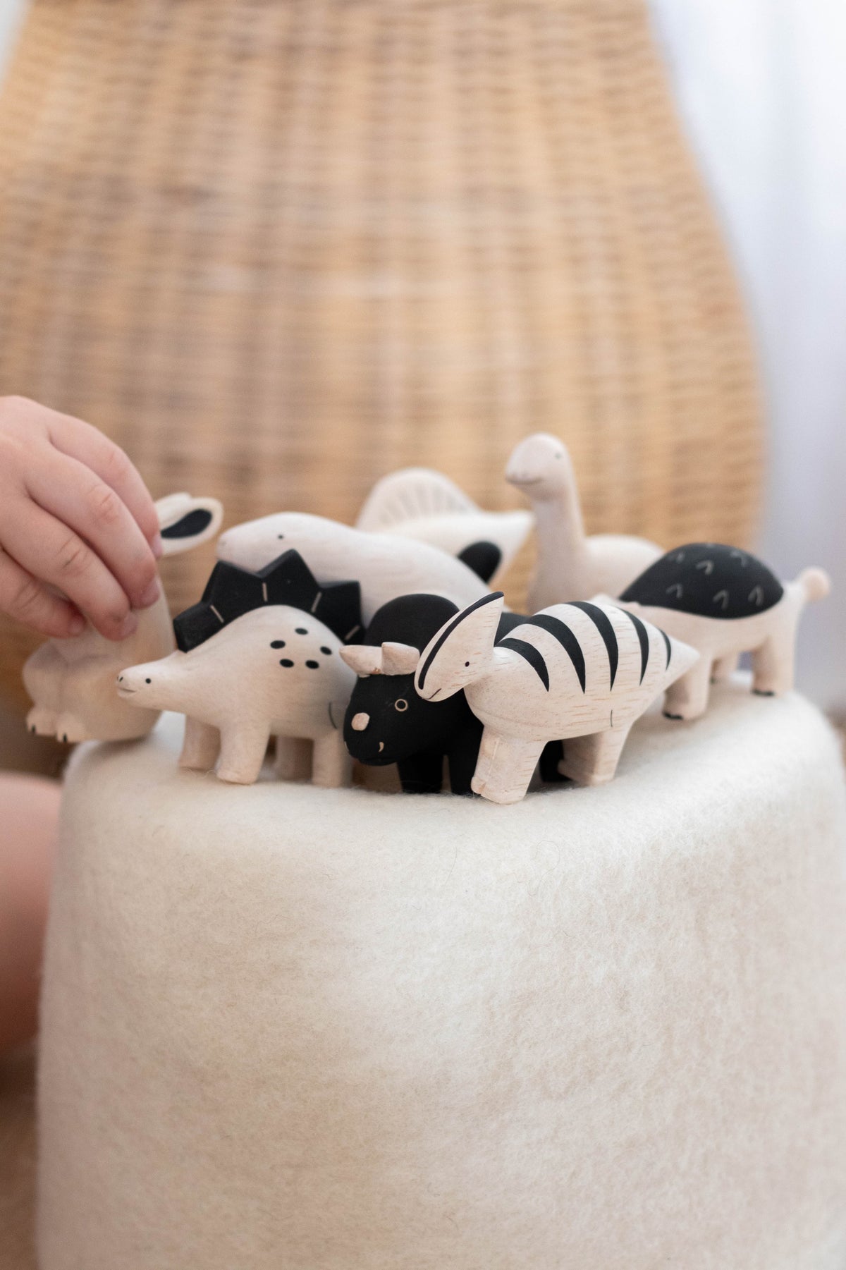 Wooden Stegosaurus figurine in a lifestyle setting