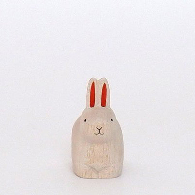 Rabbit sitting red in wood | Zodiac sign