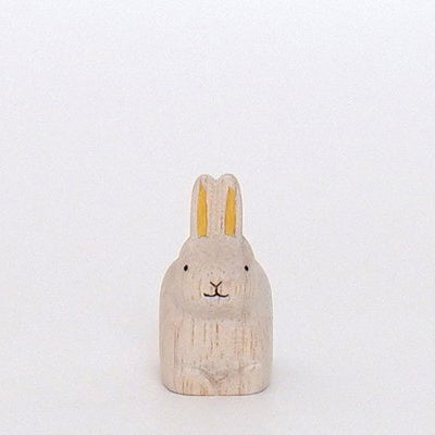 Rabbit sitting golden in wood | Zodiac sign