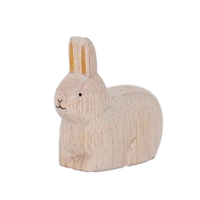 Kaninchen sitzt golden im Holz | Sternzeichen